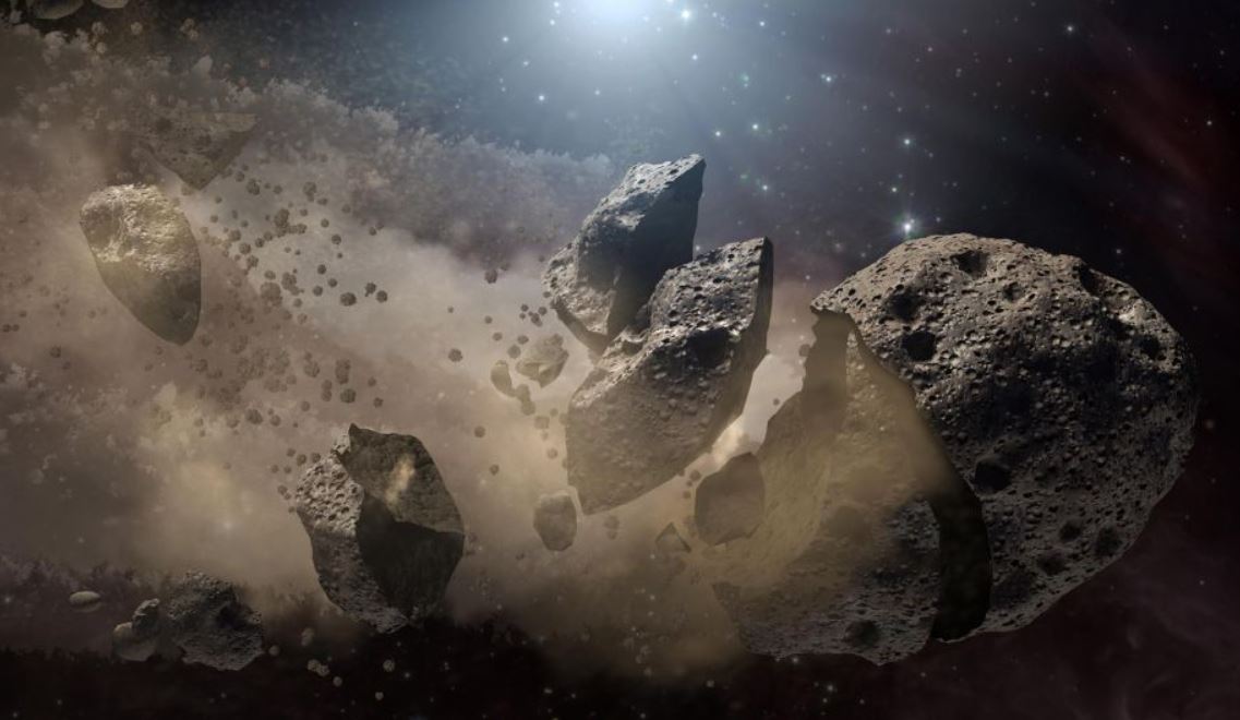 Representación artística muestra un asteroide fragmentado. Los científicos creen que un asteroide gigante, que se rompió hace mucho tiempo en el cinturón de asteroides principal entre Marte y Júpiter, finalmente llegó a la Tierra y provocó la extinción de los dinosaurios